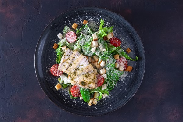 Fried chicken fillet with arugula