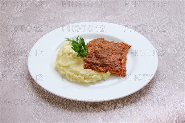 Fried hake fillet with spinach