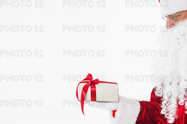 Santa claus glasses holding gift box. Resolution and high quality beautiful photo