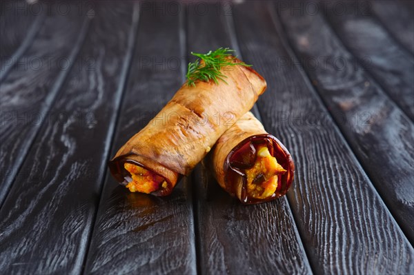 Appetizer for reception. Eggplant stuffed with fried carrot