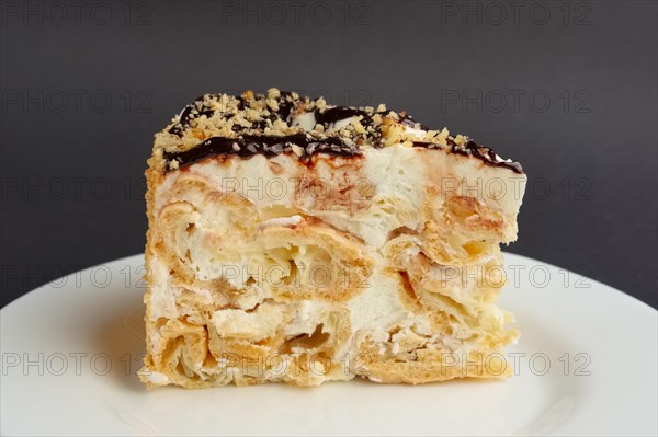 Napoleon layered cake with pastry cream. Close up view