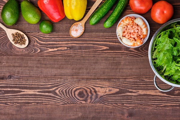 Fresh vegetables and spices on wooden table