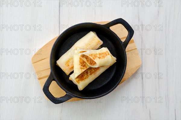 Thin pancakes stuffed with rabbit meat