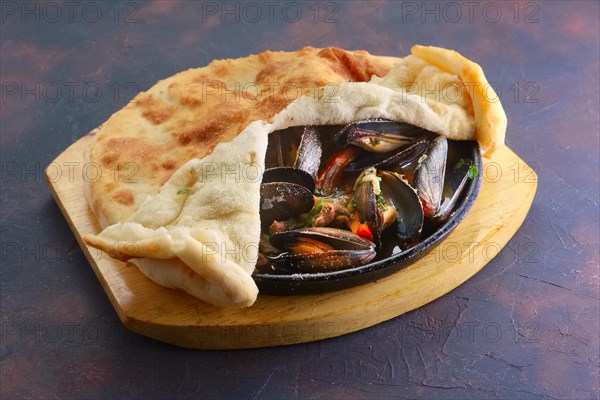 Baked oysters covered with bannock