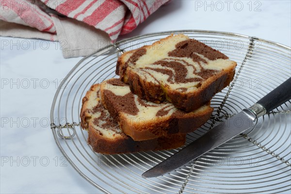 Marble cake and knife on cake rack