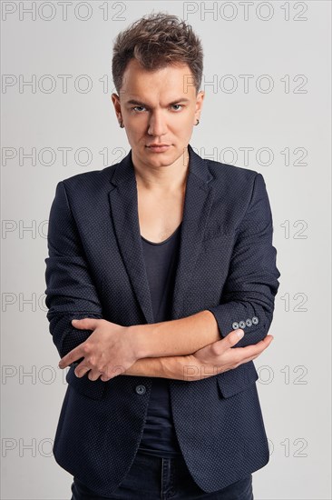 Portrait of serious man in jeans