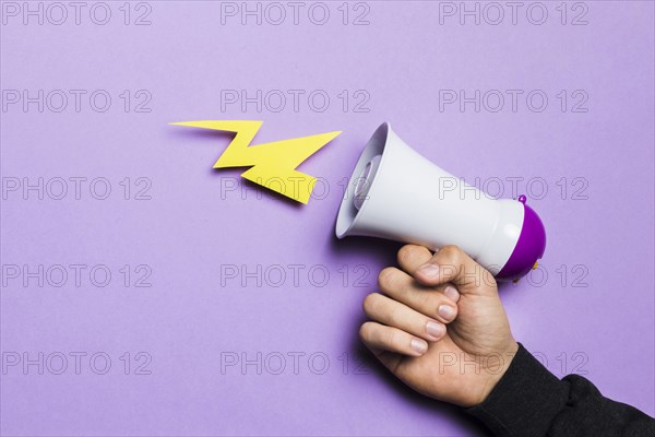 Woman s hand showing power thunder with megaphone. Resolution and high quality beautiful photo