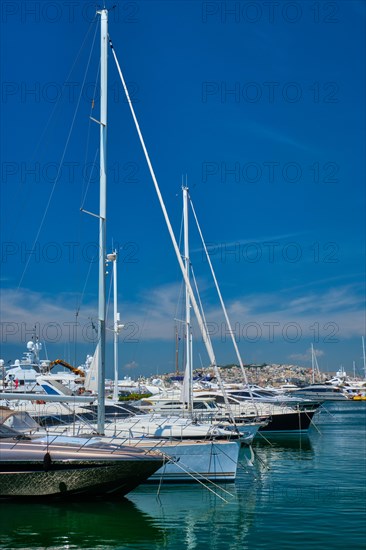 Yachts and boats moored on summer day in port of Athens. Athens