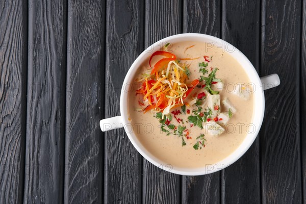 Top view of chicken soup puree with vegetables