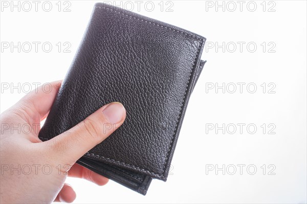 Brown leather wallet in hand saving and finance concept