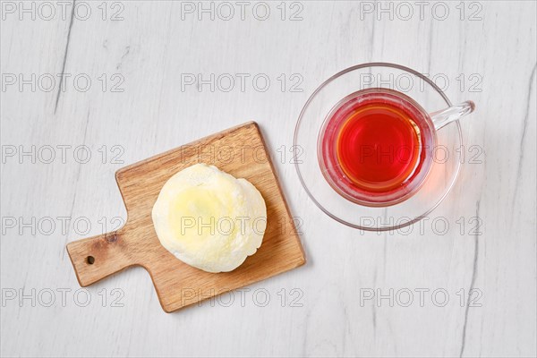 Top view of sweet dessert mochi with banana and chocolate with fruit tea