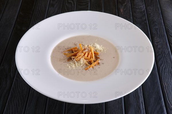 Mushroom soup puree with bacon flakes