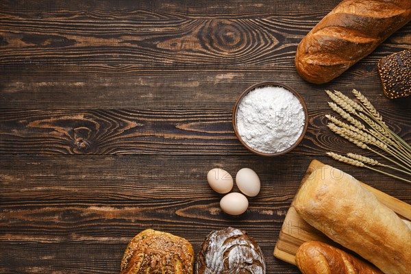 Assortment of cereal bread made of different seeds on wooden table