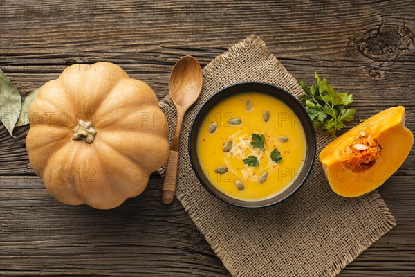 Flat lay pumpkin soup bowl with pumpkin