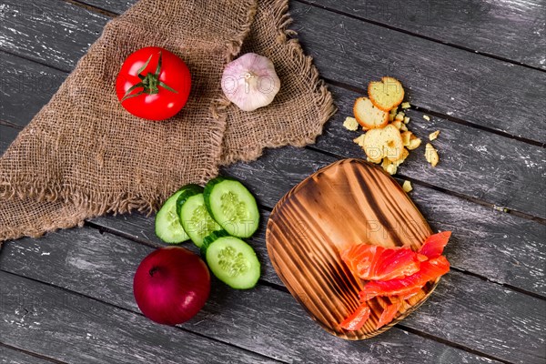 Fresh vegetables on wooden board with a napkin on a table