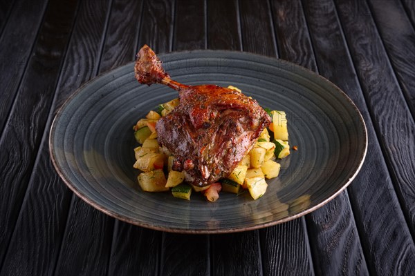 Roasted quail leg with fried potato cubes