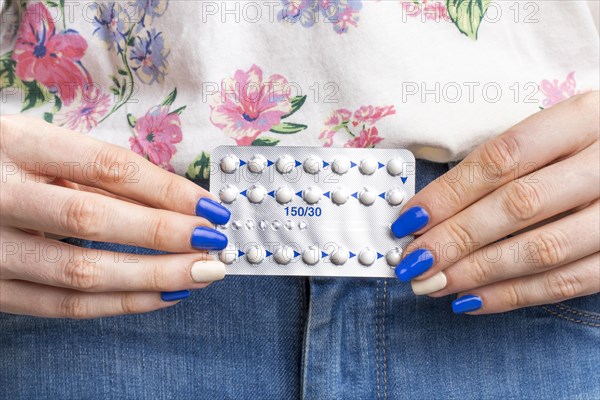 Close up woman holding pills tablet