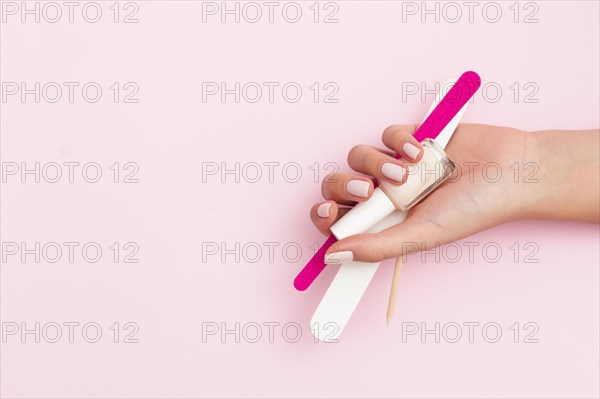 Woman holding manicure tools with copy space. Resolution and high quality beautiful photo