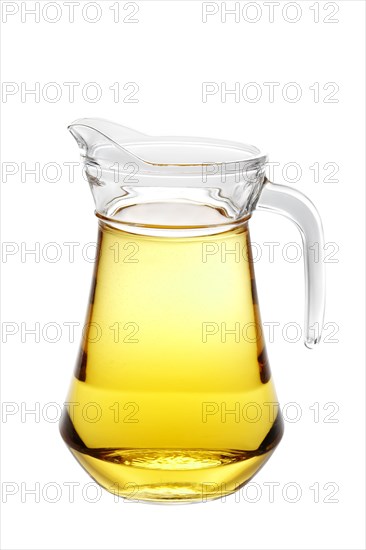 Big pitcher with apple juice isolated on white background