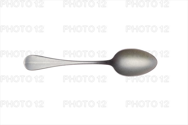 Vintage metal tea spoon isolated on white background