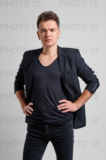 Portrait of serious man in jeans