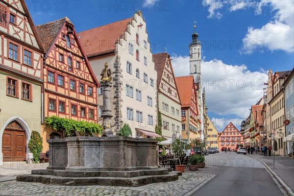 Herrnbrunnen in Herrngasse with Town Hall Tower