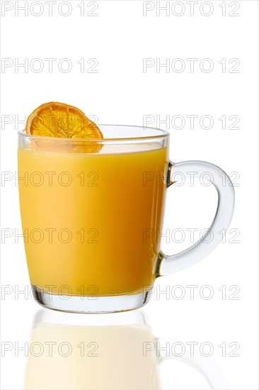Glass of warm orange tea isolated on white background
