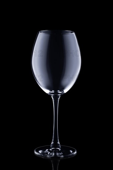 Empty wine glass isolated on black background