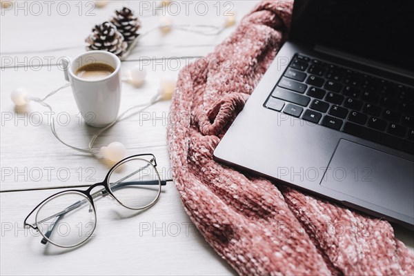 Laptop with garland on table. Resolution and high quality beautiful photo