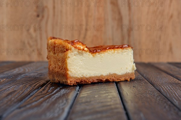 Piece of cheesecake on table