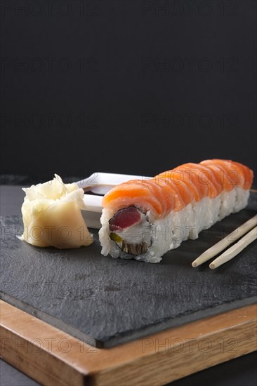 Rolls with salmon and tuna on stone plate