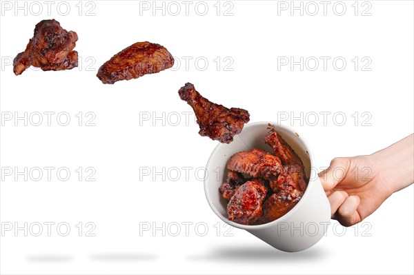 Catching flying fried chicken wings in cardboard container