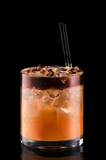 Espresso tonic with grapefruit juica isolated on black background