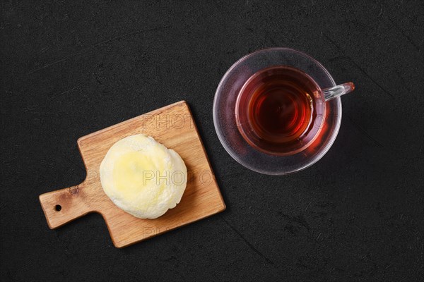 Top view of sweet dessert mochi with banana and chocolate with fruit tea