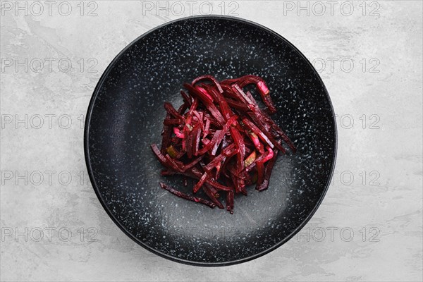 Garnish to the main dish -marinated slices of beetroot