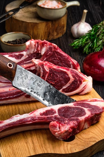 Close up view of fresh raw rack of lamb on cutting board