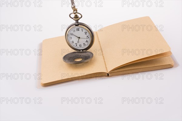 Retro style pocket watch on white background