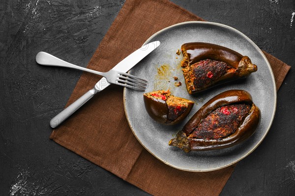 Overhead view of aubergine filled with meat and spice baked in oven