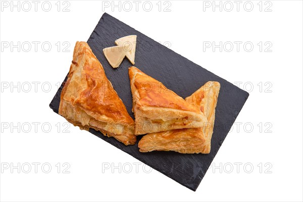 Puff pastry with cheese on slate plate