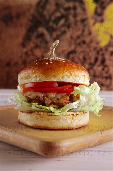 Bacon burger on wooden plate