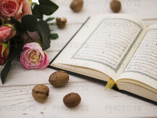 Opened quran pink roses