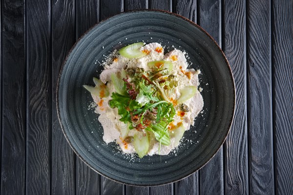 Boiled chicken fillet with vegetables and salad dripped with vinegar sauce