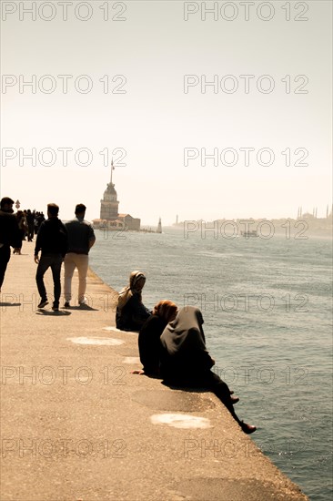 People towards Maidens Tower located in the middle of Bosporus