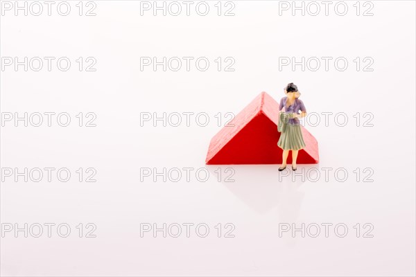 Woman figure near a color block on a white background