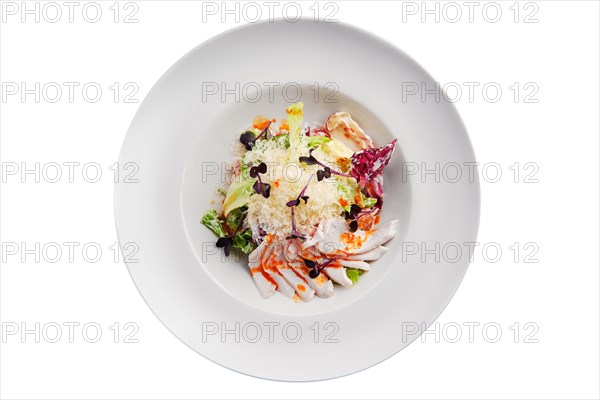 Salad with green and red cabbage and ham isolated on white background