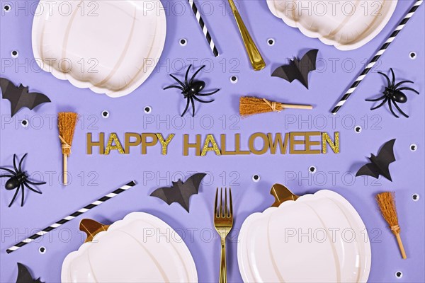 Halloween party flat lay with text 'Happy Halloween'