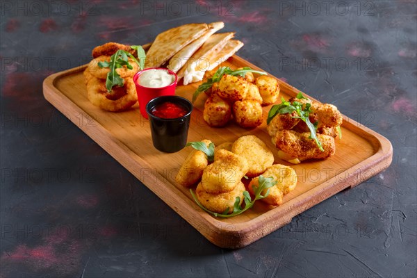 Wooden plate with snack for beer