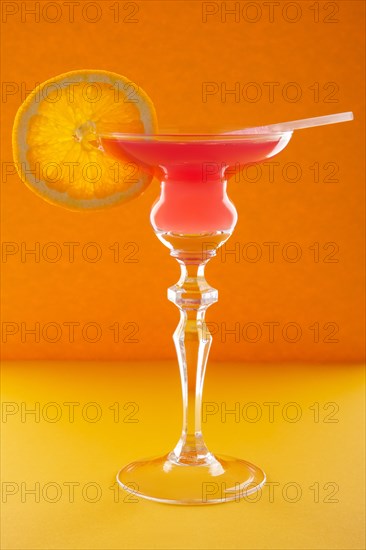 Scofflaw cocktail on orange background