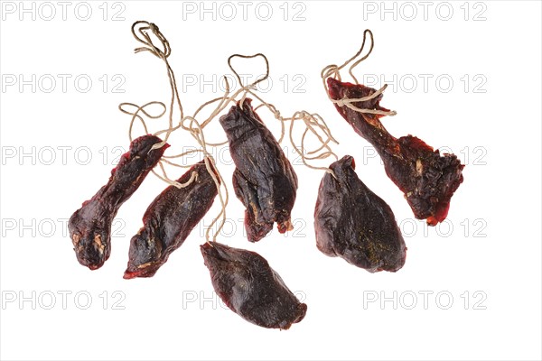 Overhead view of dried jerked deer or venison meat isolated on white background