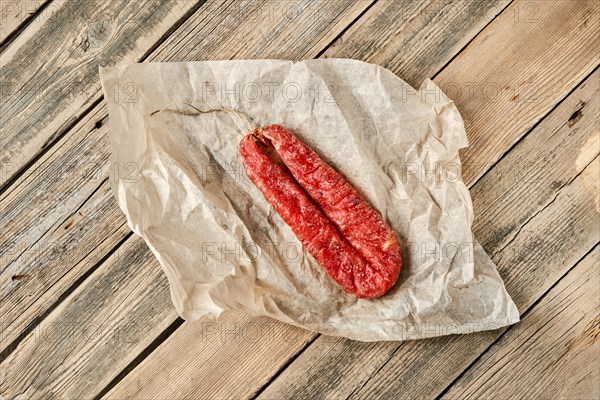 Top view of smoked dried turkey sausage on wrapping paper